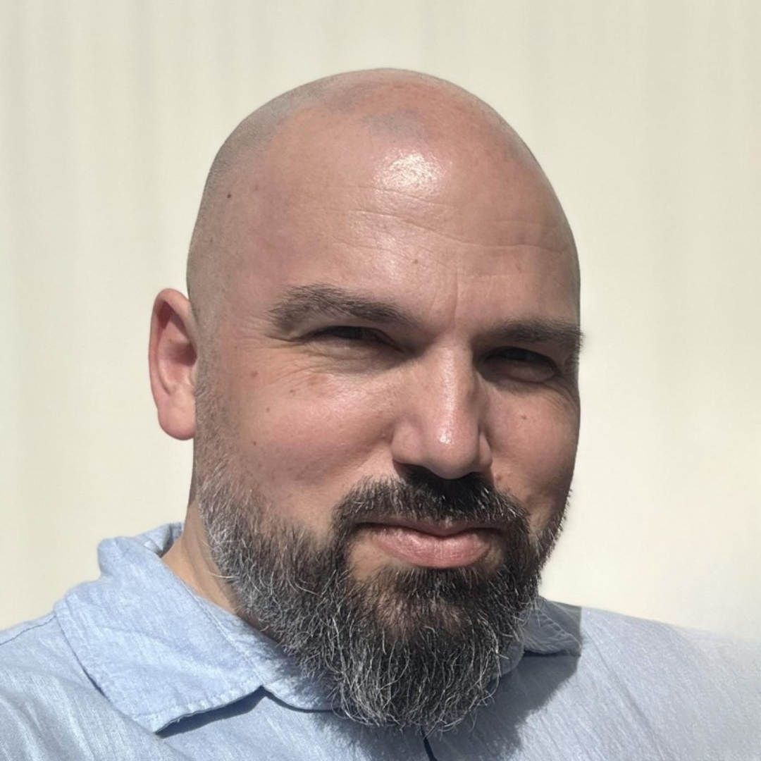Dr. Rusi Zhelev, looking at the camera.